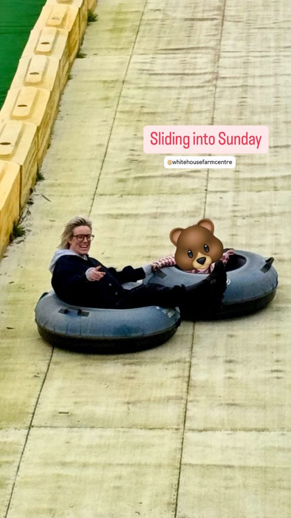 mother and daughter on toboggan slide