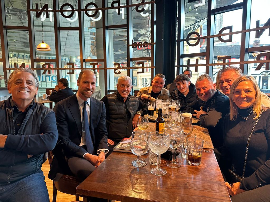 Prince William with football fans at the Wetherspoons at New Street Station in Birmingham