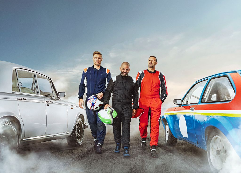 Freddie Flintoff, Chris Harris and Paddy McGuinness walk between two cars