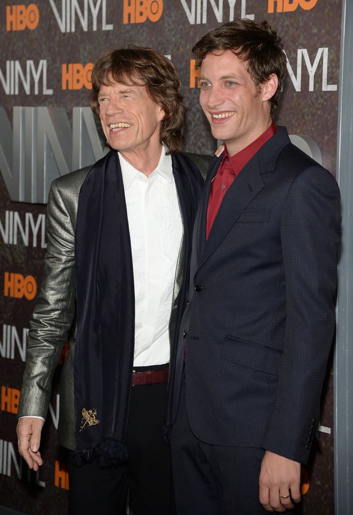 Mick Jagger posing with son James