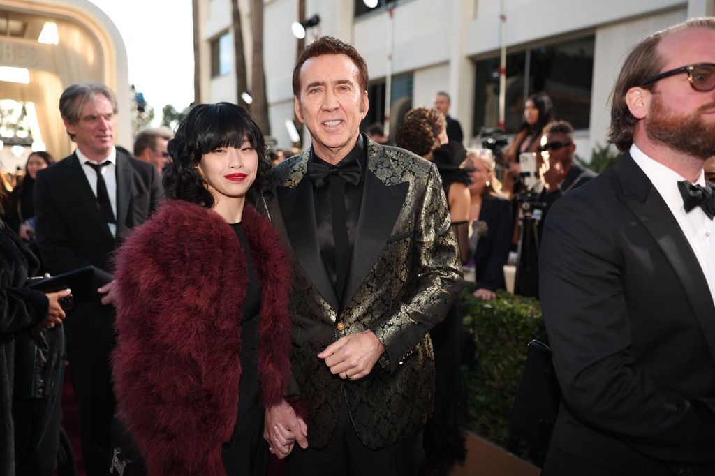 Riko Shibata and Nicolas Cage at the 81st Golden Globe Awards held at the Beverly Hilton Hotel on January 7, 2024 in Beverly Hills, California. (Photo by Christopher Polk/Golden Globes 2024/Golden Globes 2024 via Getty Images)