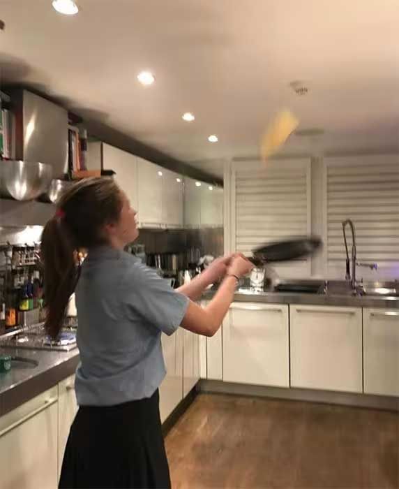 13 jane moores kitchen with someone flipping pancakes