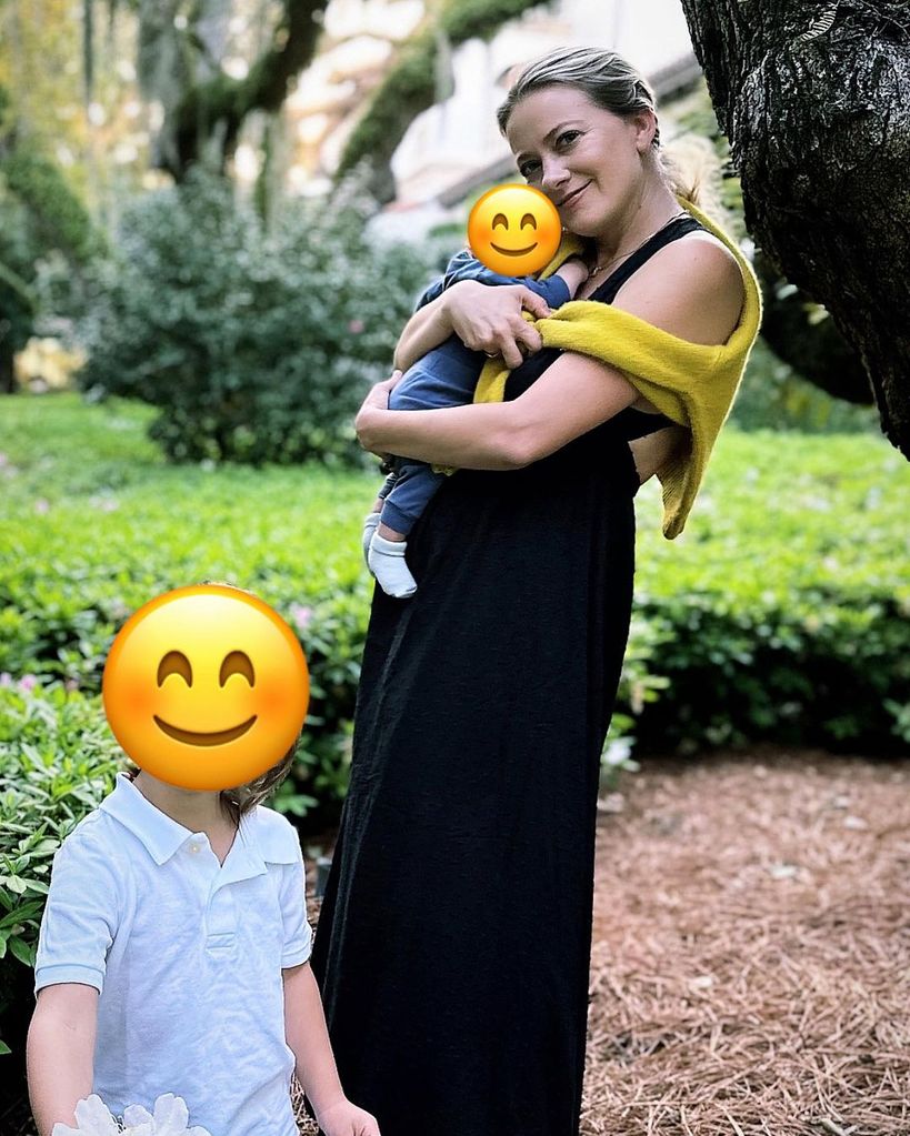 Wyatt Russell's wife Meredith Hagner poses with son Boone in her arms and son Buddy standing in front 