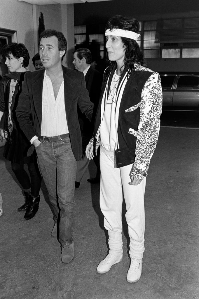 David Geffen and Cher attend an event at the MGM lot in Culver City, California, on January 28, 1983