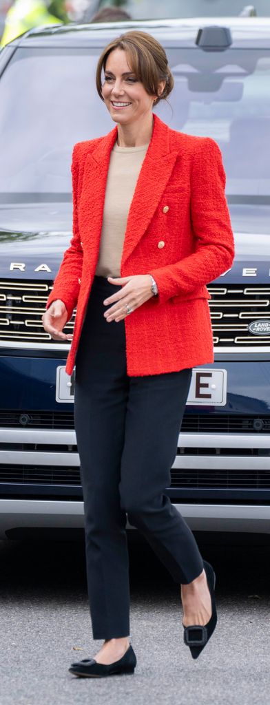 Princess Kate walking in a red blazer
