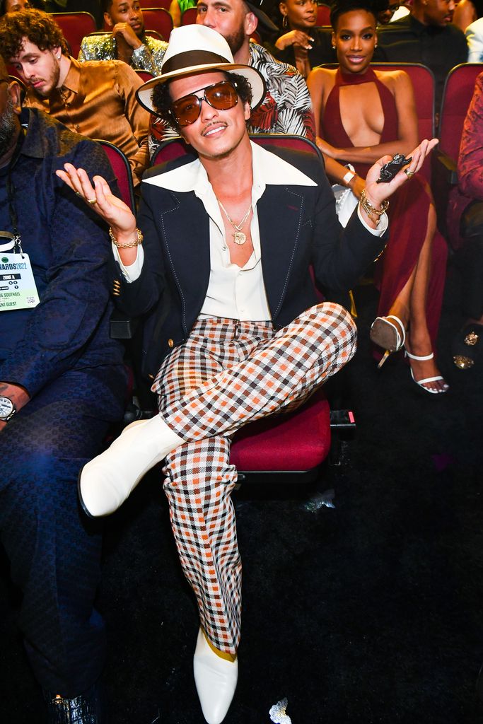 A photo of Bruno Mars wearing chequered trousers