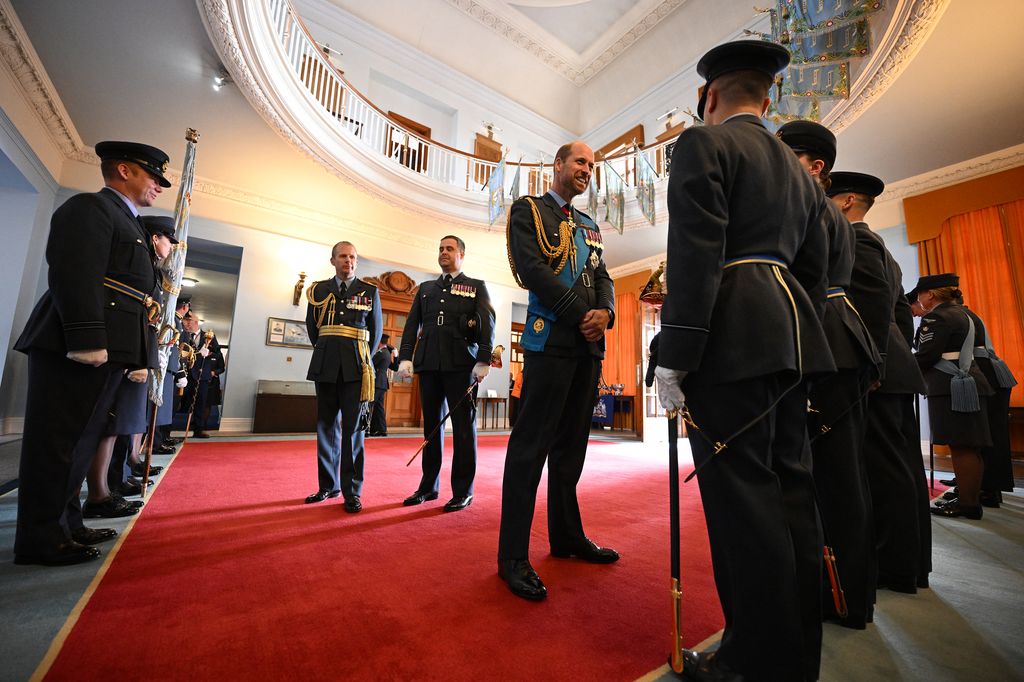 Britain's Prince William, Prince of Wales speaks with Parade Executives in the rotunda of the Royal Air Force (RAF) College in Cranwell