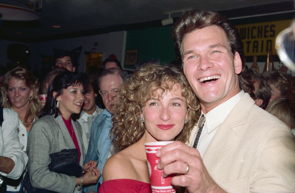 Jennifer Grey gives a wink and a wave to cameras as she and her co-star Patrick Swayze attend a party following the showing of their latest movie Dirty Dancing, 1987