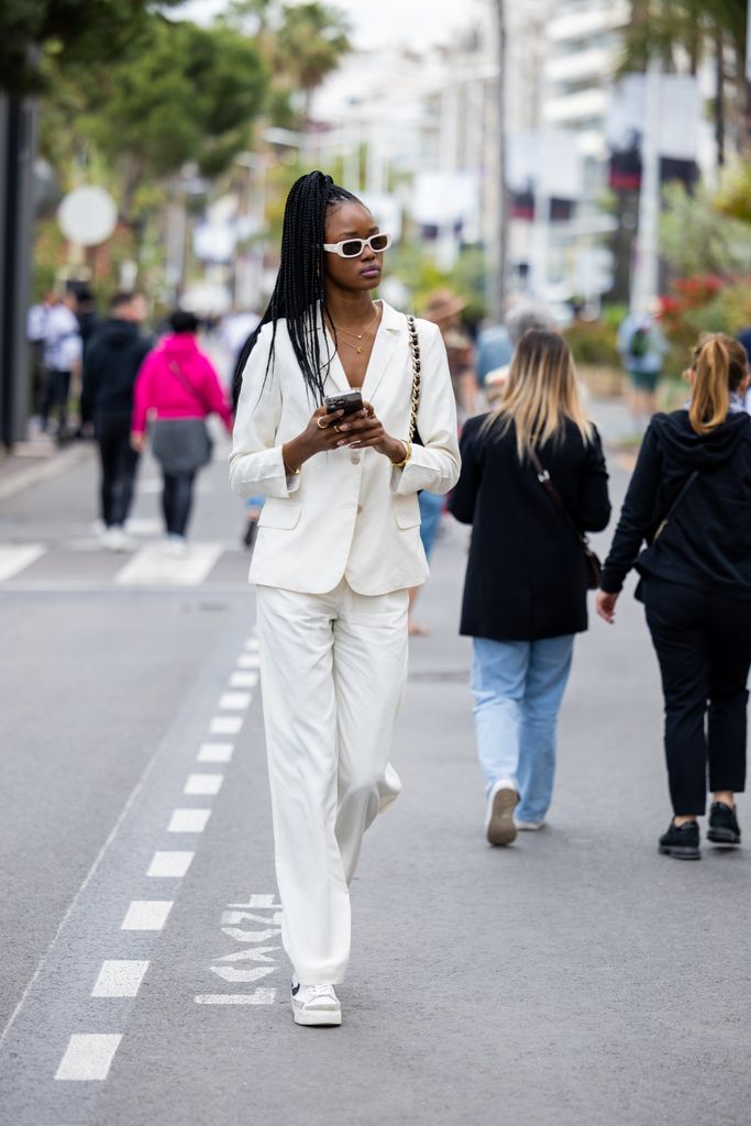 A guest looked chic in an all white tailored suit