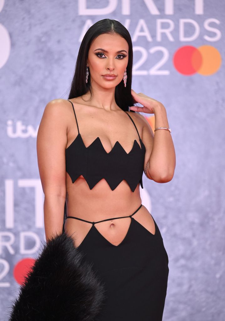 Maya wearing a black cut-out dress on the red carpet