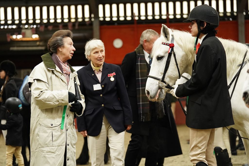 Princess Anne speaks with horse rider