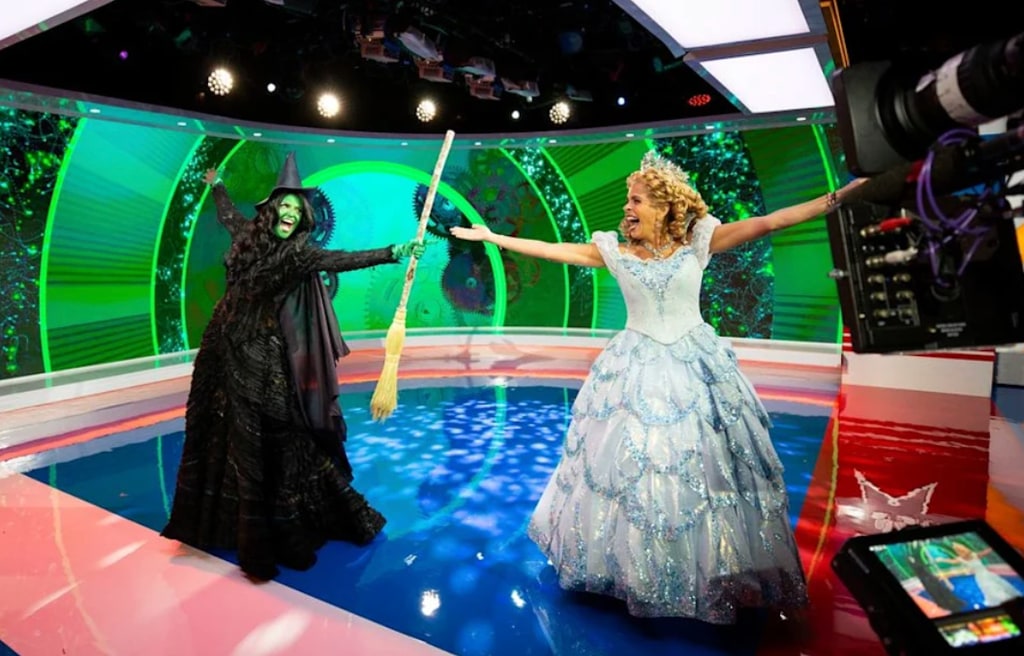 Savannah Guthrie and Hoda Kotb dressed as Elphaba and Glinda