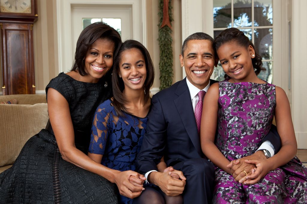 In this handout provided by the White House, (L - R) First Lady Michelle Obama, Malia Obama, U.S. President Barack Obama and Sasha Obama, sit for a family portrait in the Oval Office on December 11, 2011 in Washington, D.C