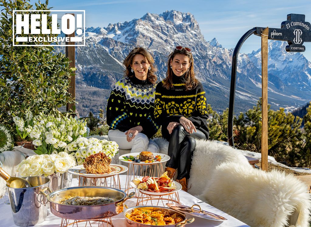 Maria Paola Merloni and daughter Vittoria posing in matching jumpers in front of Italian Dolomites