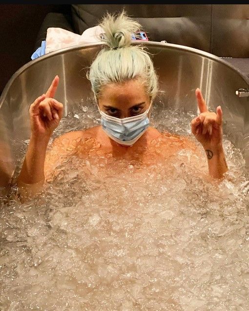 lady gaga wearing face mask submerged in ice bath