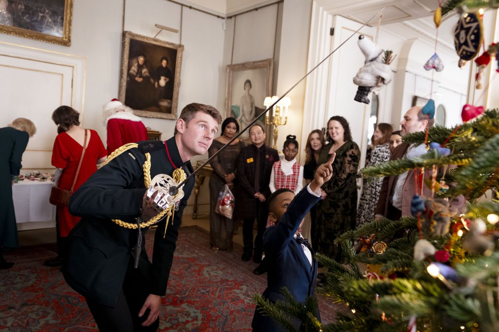 Major Rob Treasure helped the children decorate the Christmas tree