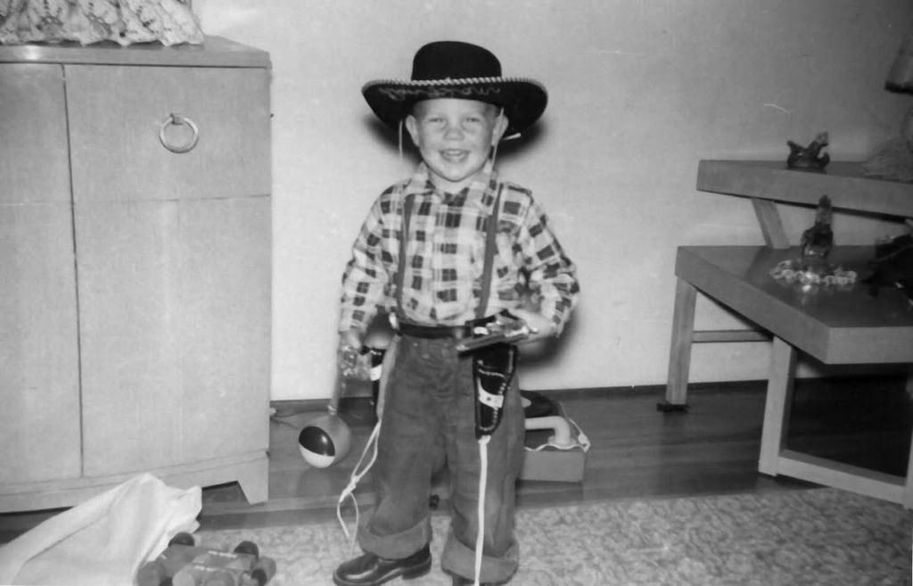 Picture of Kevin Costner as a toddler dressed as a cowboy