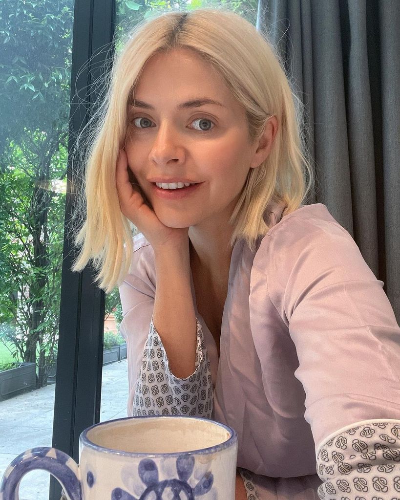 Holly Willoughby takes a selfie while drinking a cup of tea