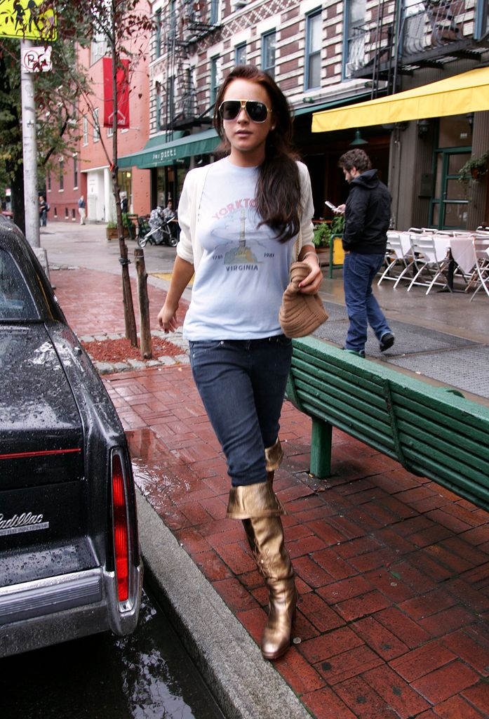 Lindsay Lohan in jeans, white top and metallic boots 2006