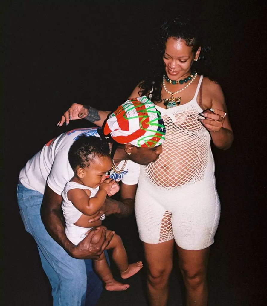 Rihanna's partner Rocky kisses her bump while holding their son