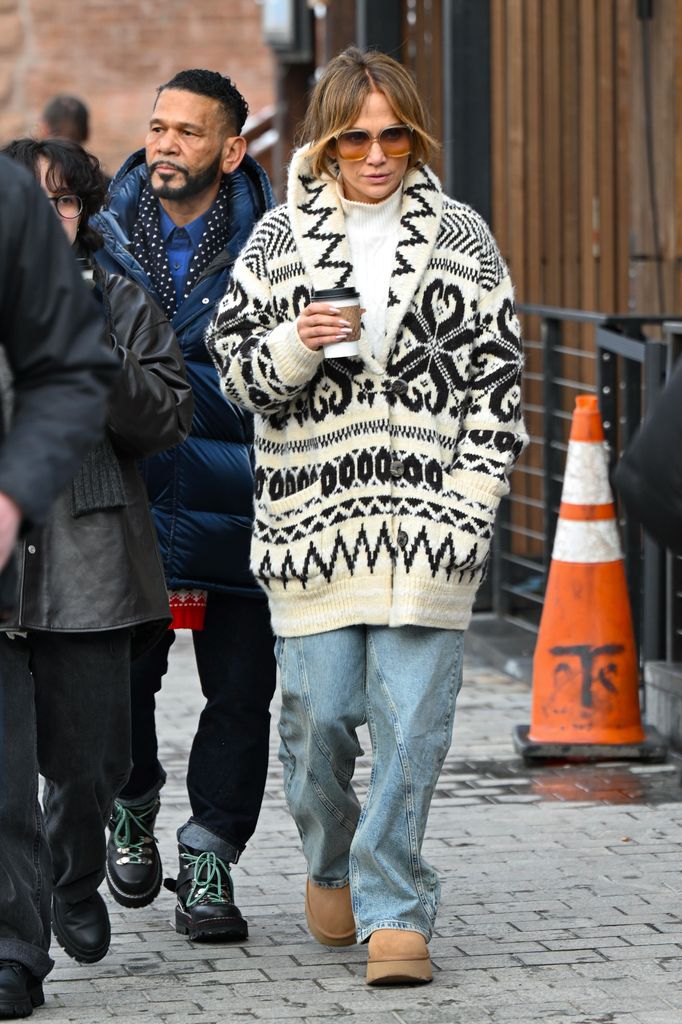 Jennifer Lopez in printed cardigan and jeans