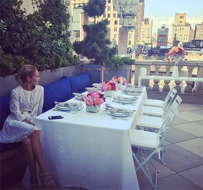 Kelly Ripa sitting on her Upper East Side terrace