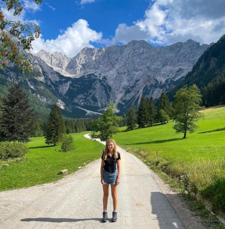 Carrie Johnson posing in front of mountains in Slovenia