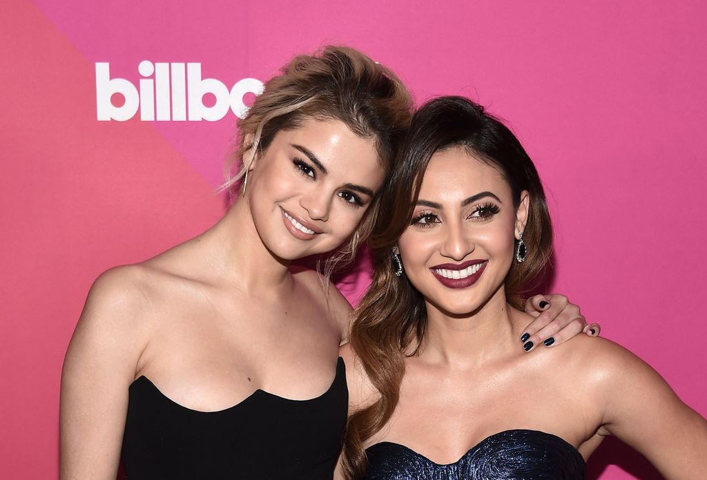 Selena Gomez (L) and actress Francia Raisa arrive at Billboard Women In Music 2017