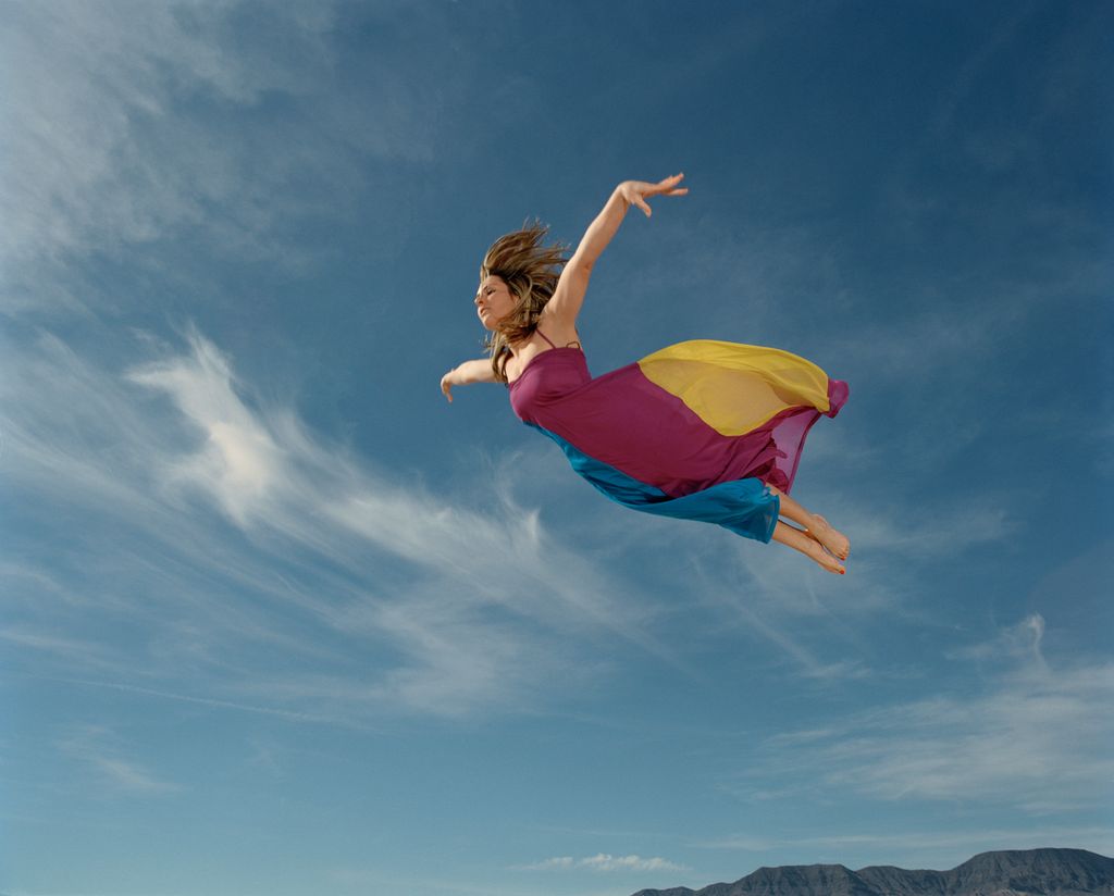 A woman flying through the sky 