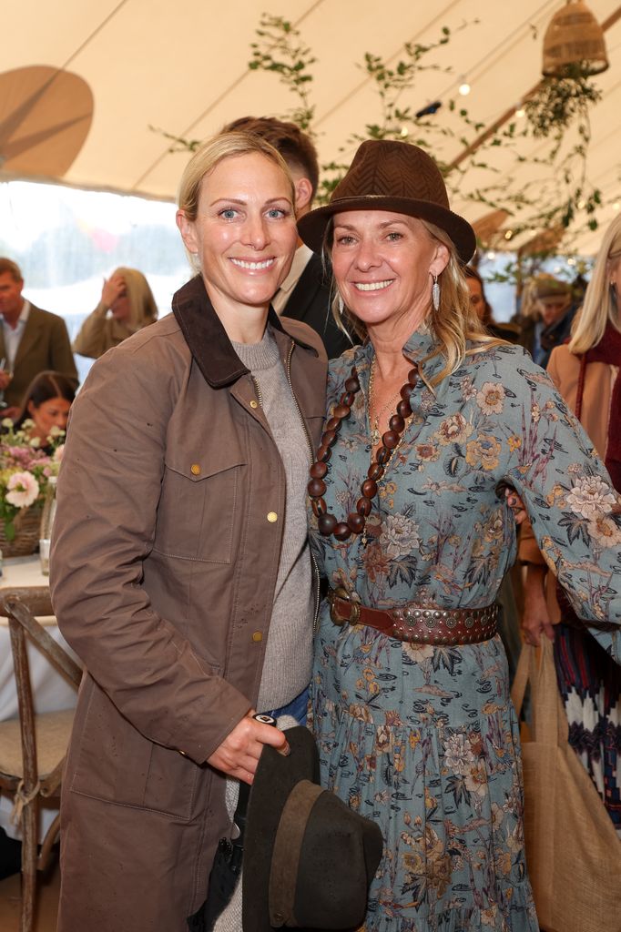 Zara Tindall smiling in barn jacket with Fiona Howden