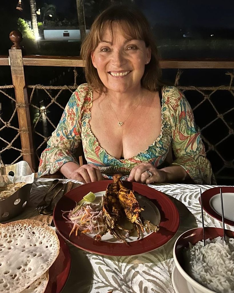 Lorraine Kelly smiling whilst at dinner in India 