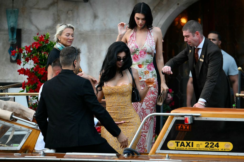 Kendall Jenner (top) and US entrepreneur Kylie Jenner leave the Gritti Palace Hotel ahead of the wedding of Amazon's founder Jeff Bezos with Lauren Sanchez in Venice on June 26, 2026