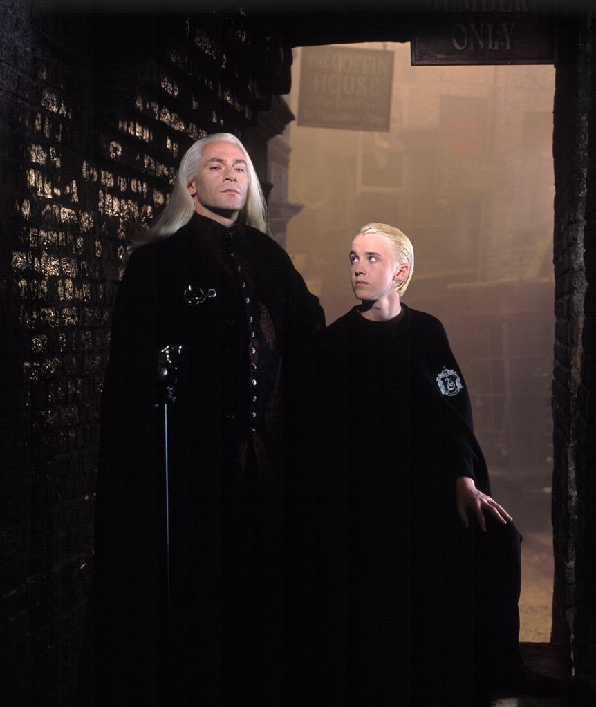 Jason Isaacs as Lucius Malfoy and Tom Felton as Draco Malfoy in Harry Potter 