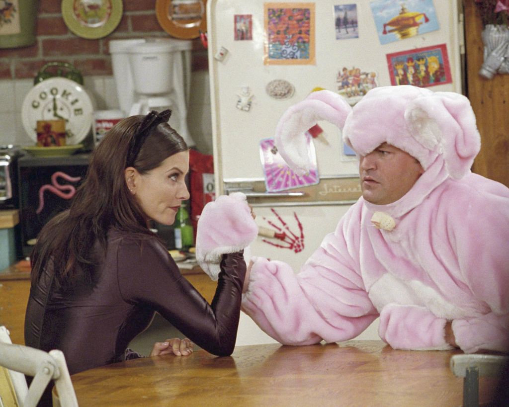 FRIENDS -- "The One with the Halloween Party" -- Epsiode 6 -- Aired 11/1/2001 -- Pictured: (l-r) Courteney Cox as Monica Geller-Bing as "Catwoman", Matthew Perry as Chandler Bing as "Big Pink Bunny"-- Photo by: NBCU Photo Bank