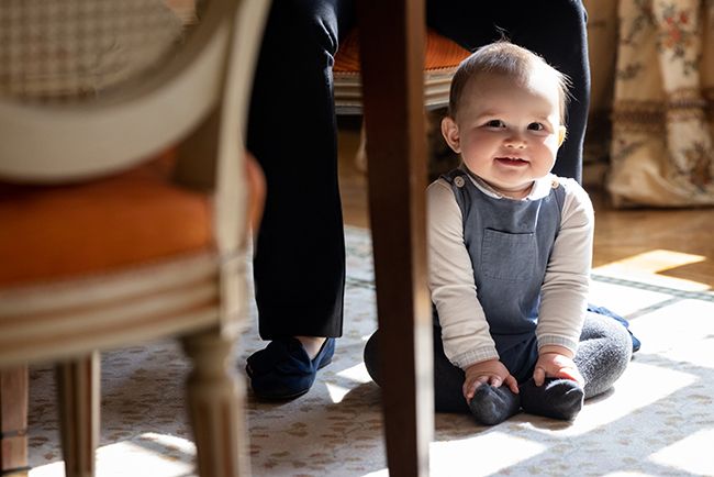 baby prince charles under table