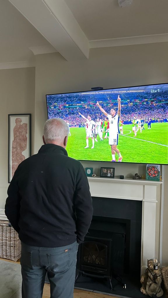 Helen shared a photo of her family watching the football 
