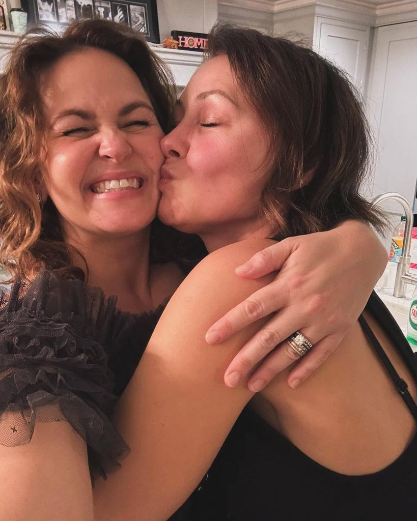 Emma Willis kissing giovanna on cheek