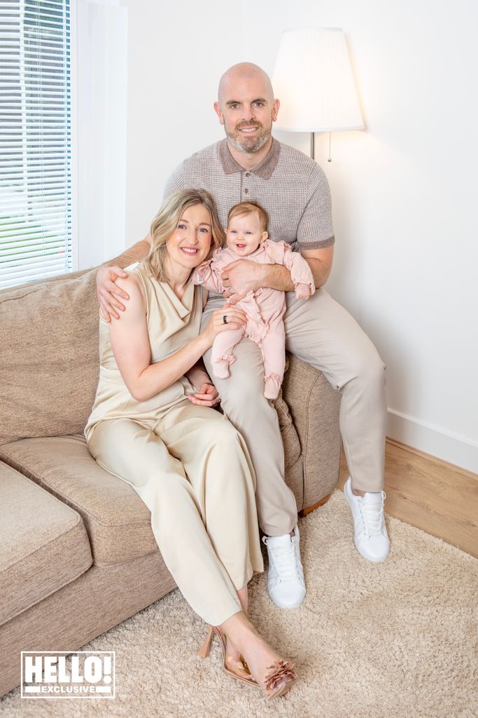 Ellen White poses with her baby girl and her husband Callum
