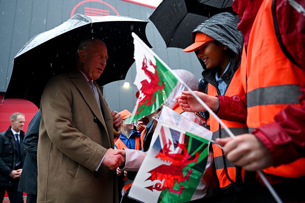 King Charles greeted by well-wishers after his official opening of the South Wales Metro Depot at Taff's Well Transport Depot