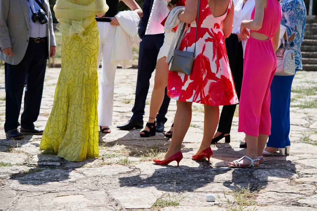 Low section view of group of people waiting outdoors wears formal clothes for a wedding