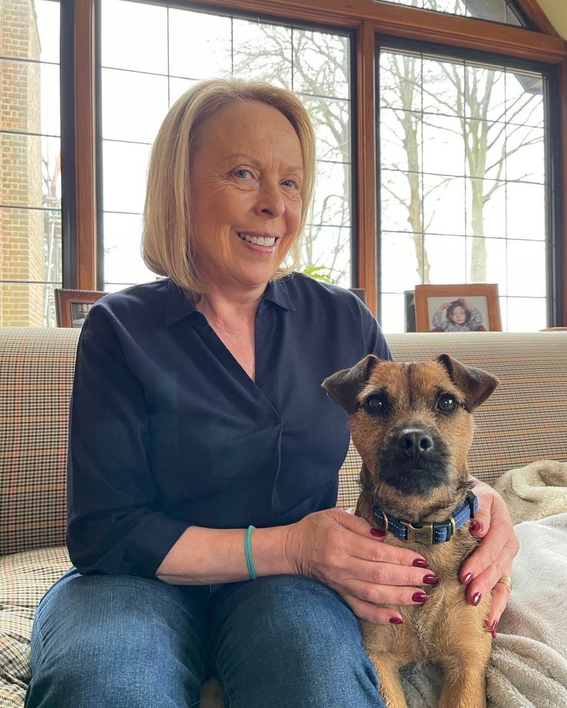 Jayne Torvill with her dog in her lounge