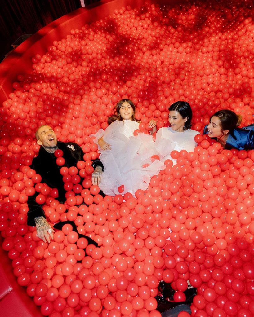 Kourtney, Travis and Penelope in the ball pit with Addison