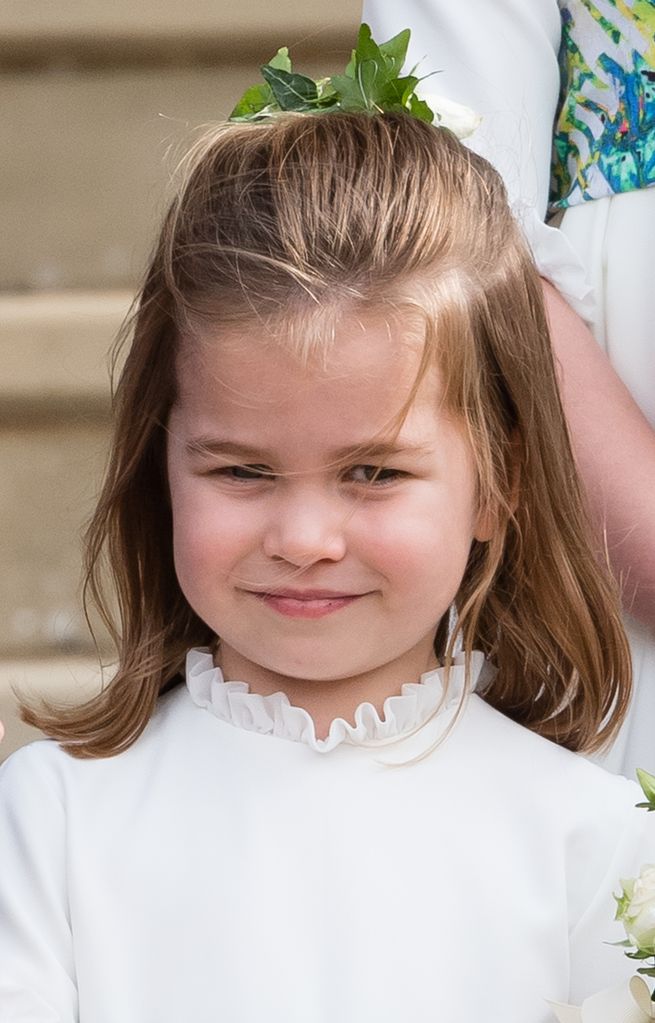  Princess Charlotte attends the wedding of Princess Eugenie of York and Jack Brooksbank at St George's Chapel in Windsor Castle on October 12, 2018 in Windsor, England