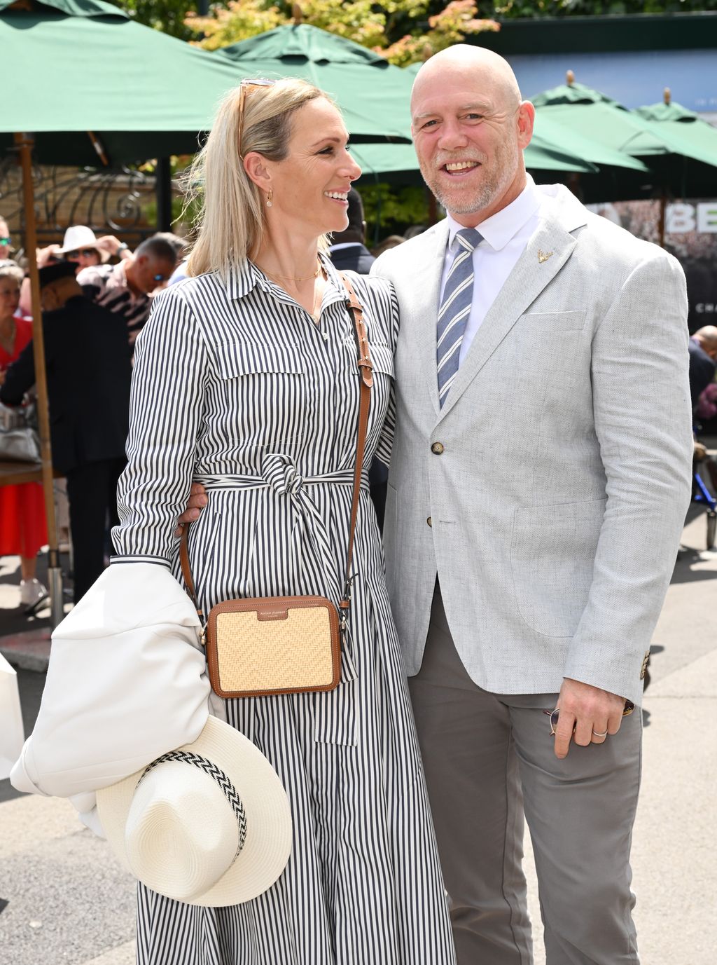 Zara Tindall looks at husband Mike Tindall as they arrive at Wimbledon