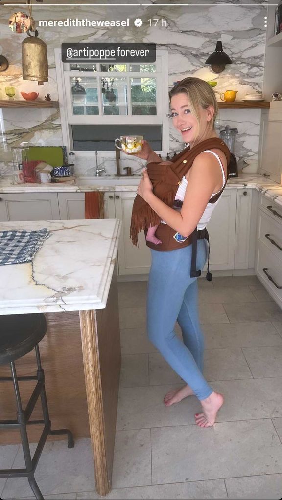 Meredith carrying baby Boone