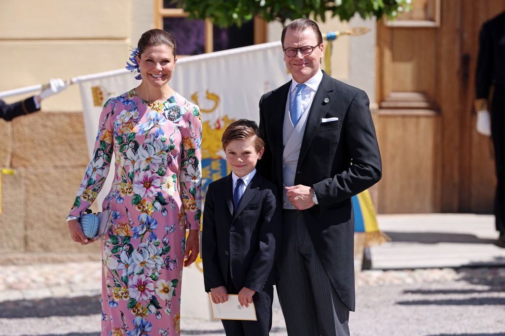 Crown Princess Victoria in floral dress with Prince Daniel and Prince Oscar