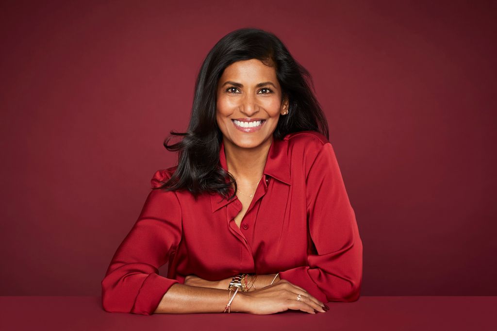 smiling lady in red shirt