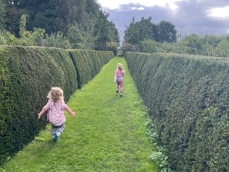 elsie running through garden 