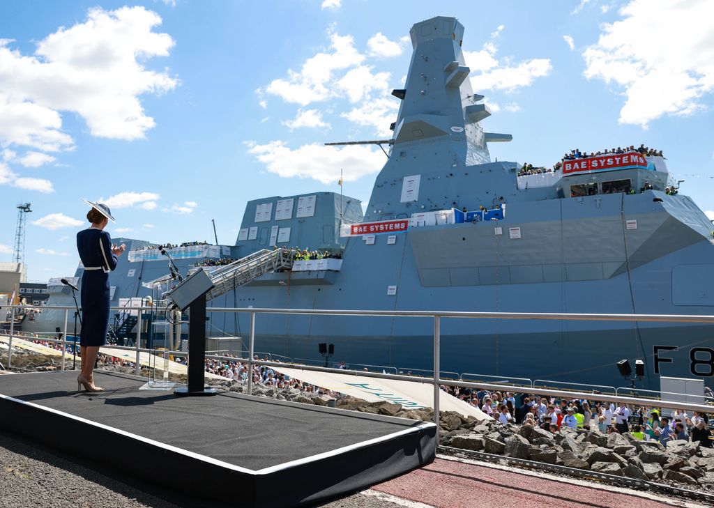 Kate Middleton standing on podium in front of HMS Glasgow
