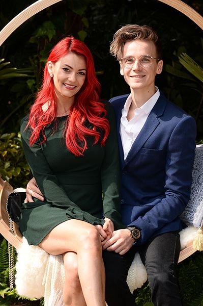 Dianne Buswell looks glamorous in green as she sits with Joe Sugg